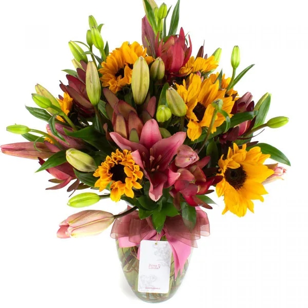 Saludo al sol rosado - Ánfora con liliums rosados, girasoles y leucadendros